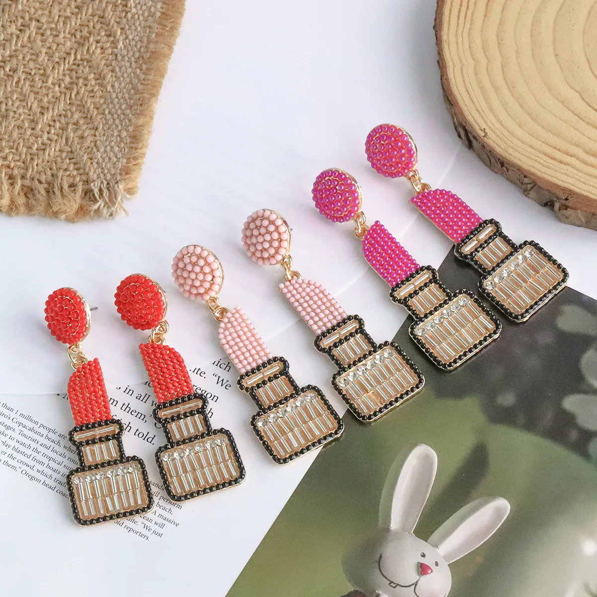 

Dainty Zircon Alloy Exaggerated Rice Beads Disc Lipstick Pendant Earring For Women Wholesale