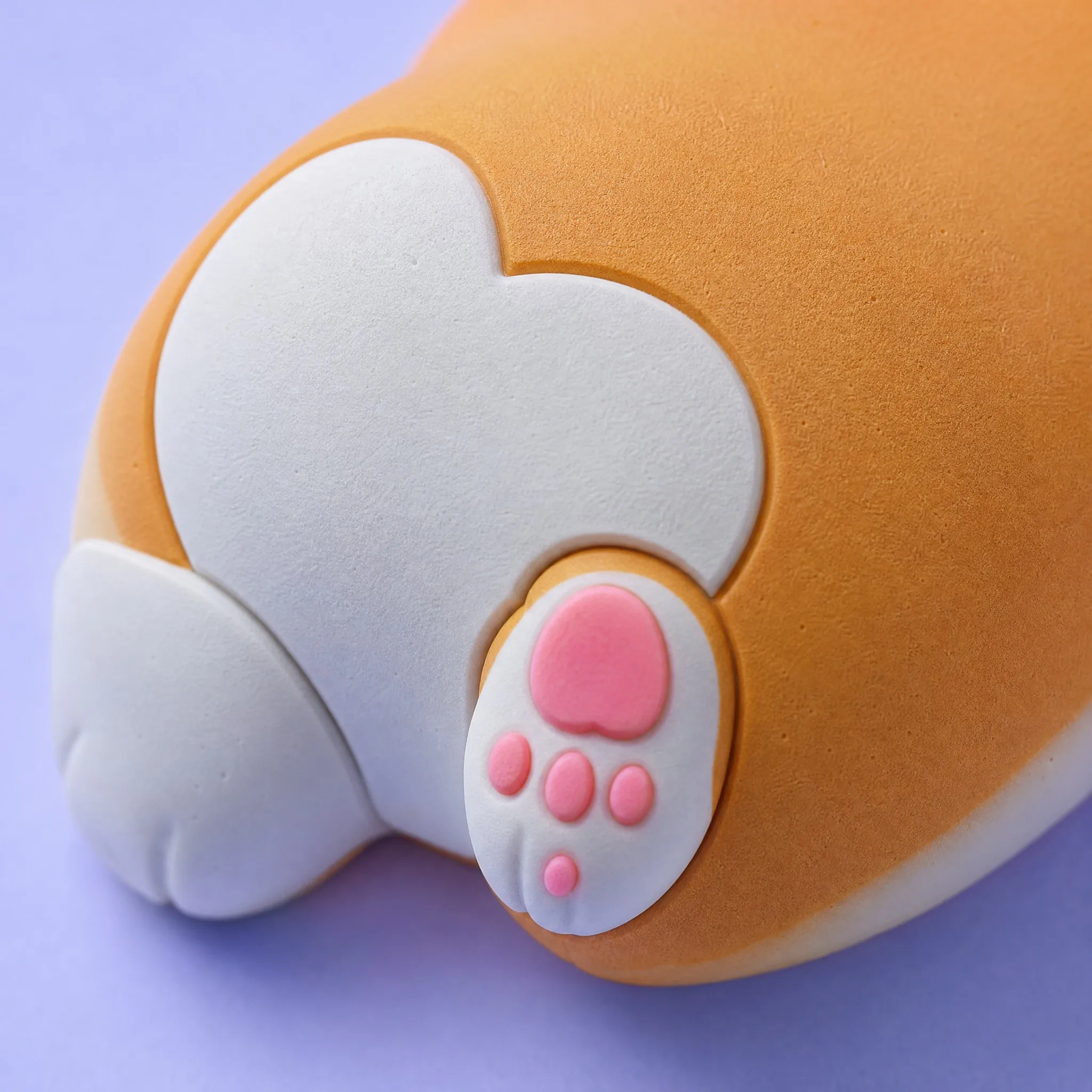 Macro Detail of 3D Soft PVC Corgi Butt Magnet Showing Pink Paw Beans and Velvet Matte Texture