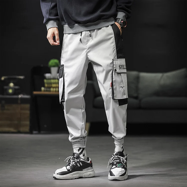 

New men Loose Falling feeling Big pocket Harem pants fashion Handsome boy Leisure Beam foot Cargo pants, Colors