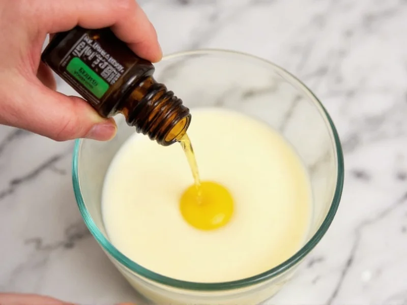 Adding essential oils to melted wax in glass container