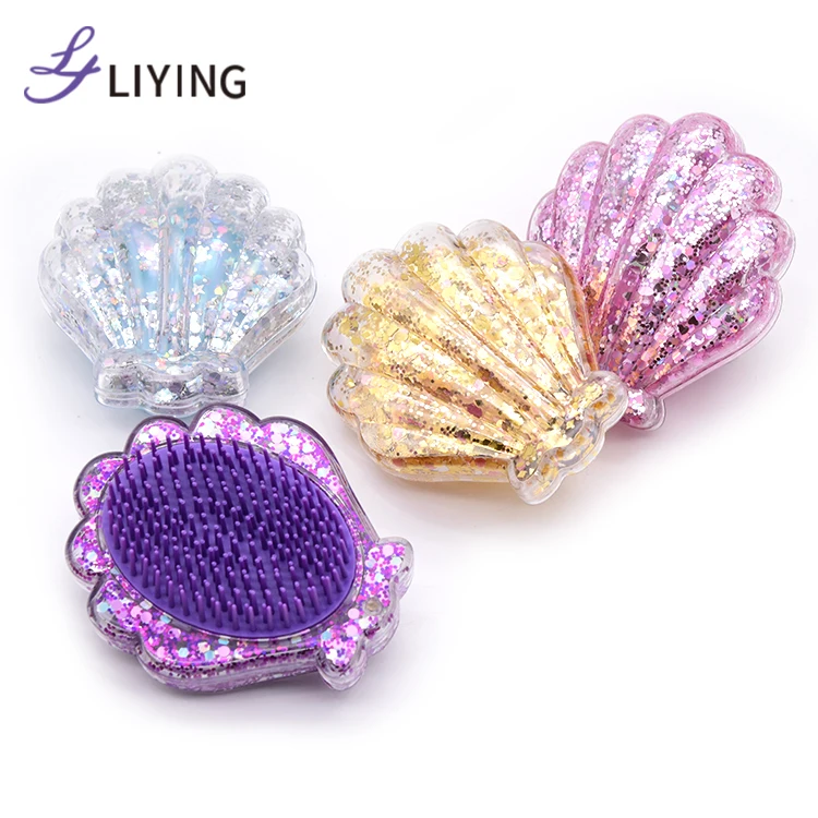 

New design professional custom logo glitter mermaid shape shell hair brushes wholesale