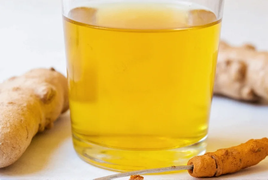 Turmeric ginger shots served in small glasses with fresh ingredients