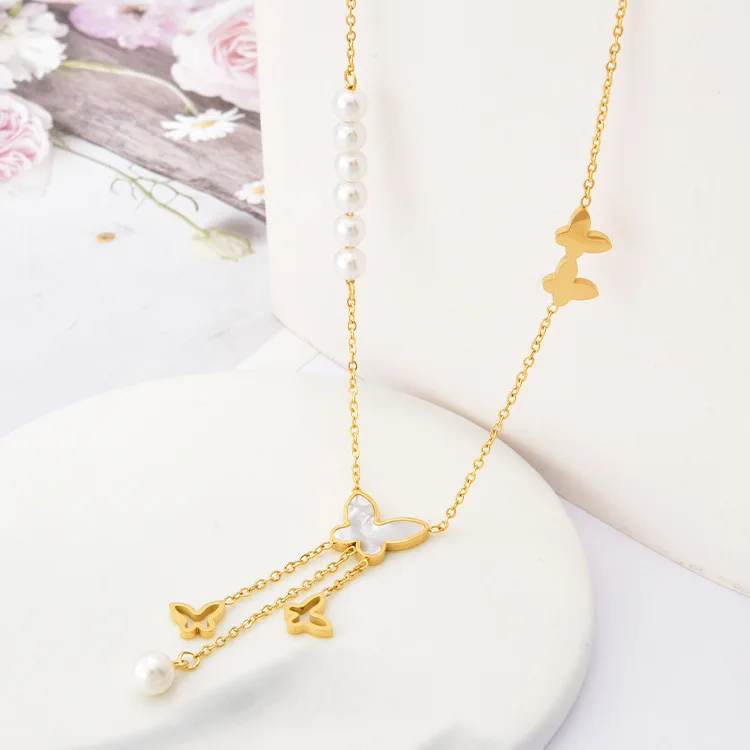 

White shell butterfly pearl necklace for women Titanium steel hollow long tassel pendant Electric gold plated color necklace