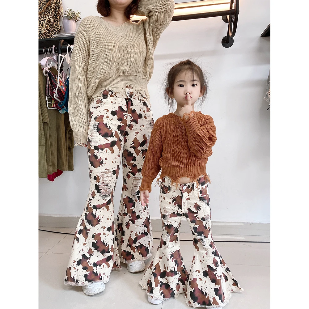 

2021 New Arrival Cow pattern bell bottoms loose hole zipper denim flared pants