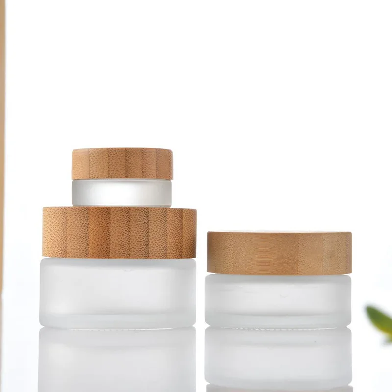 

Hot selling cosmetic packaging 5g 20g 30g 50g 100g 200g frosted glass cream jars with bamboo lids