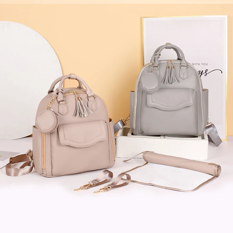 

premium pu Leather Backpack Diaper Bag with Laptop Compartment Travel changing bag with inluated pouch and stroller straps, Customized color