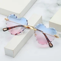 

Fashion Wave Frame Rimless Heart Shape Sunglasses 2020 New Arrivals Colorful Ocean Lens UV400 Sun Glasses