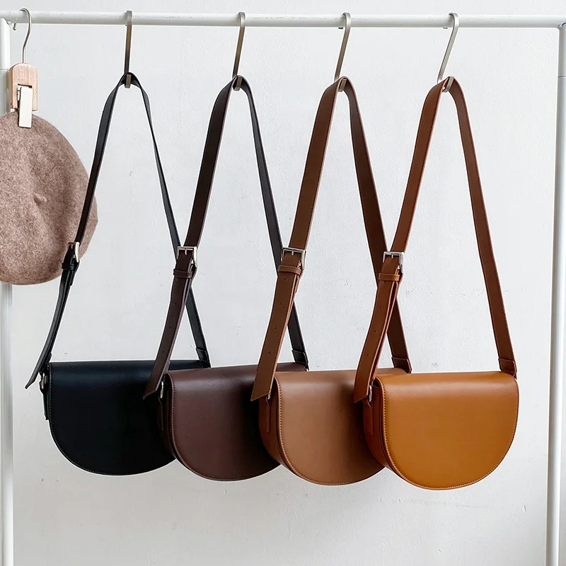 

New female solid color creative design one-shoulder cross-body bag fashion trend semicircle bag clamshell saddle bag