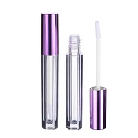 

3ml cylinder shaped lipgloss with metallic purple color applicator wands