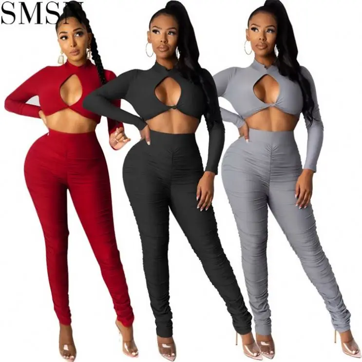 

TINA Best Design Solid Color Long Sleeve Hollow Out Two Piece Set Pants Yoga Sets For Women Two Piece