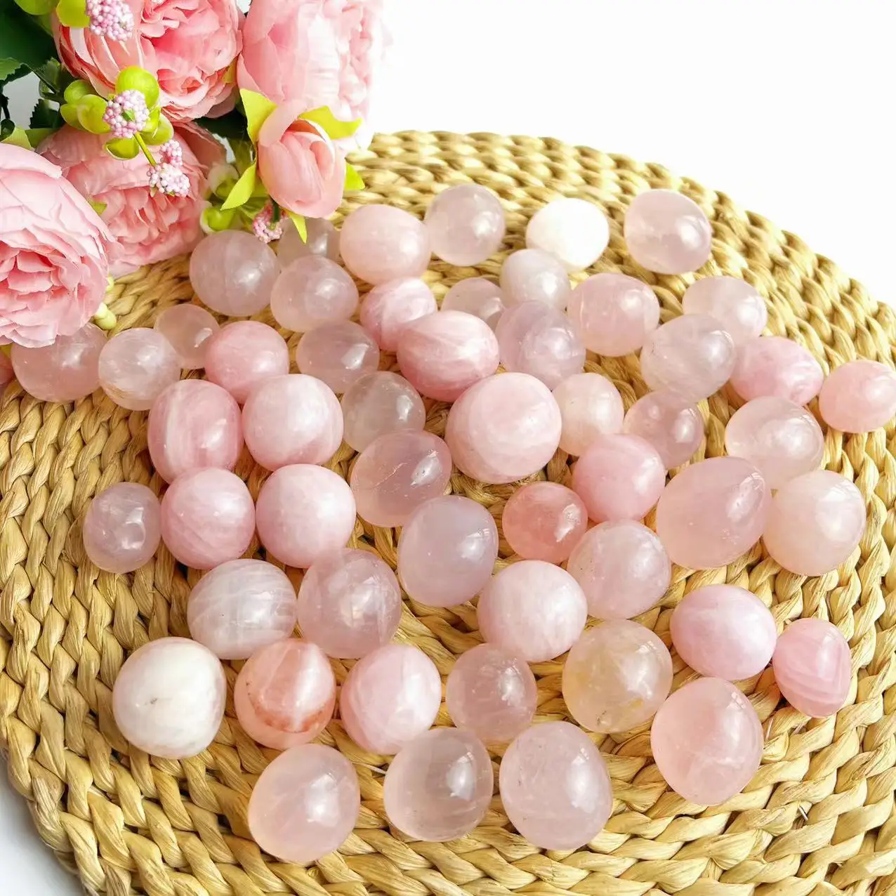 

Natural rose quartz polished tumbled stone crystal gravel for decoration.