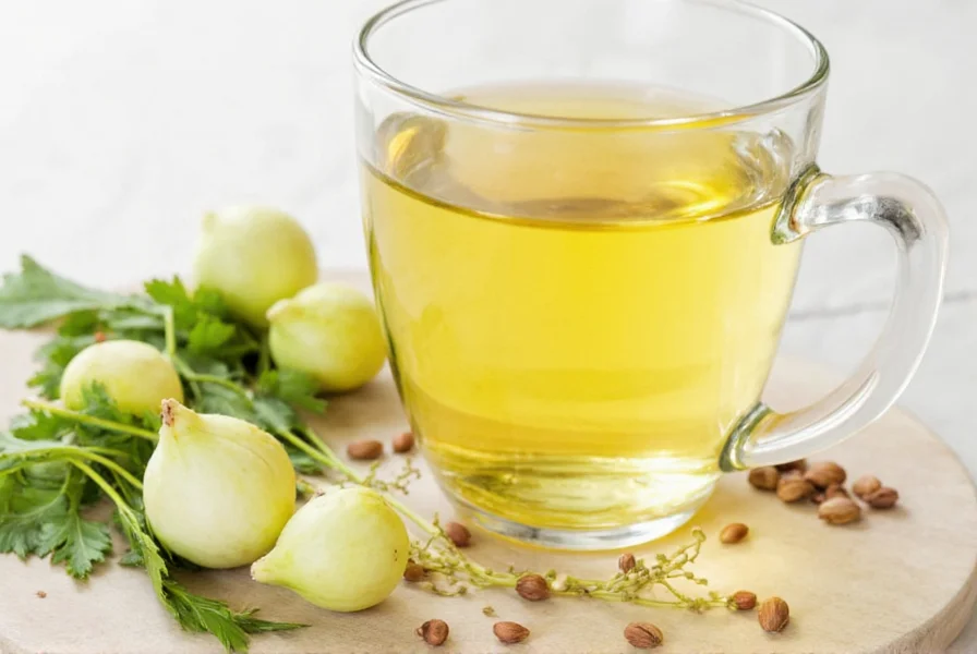 Fresh fennel seeds and brewed fennel tea in a glass teapot