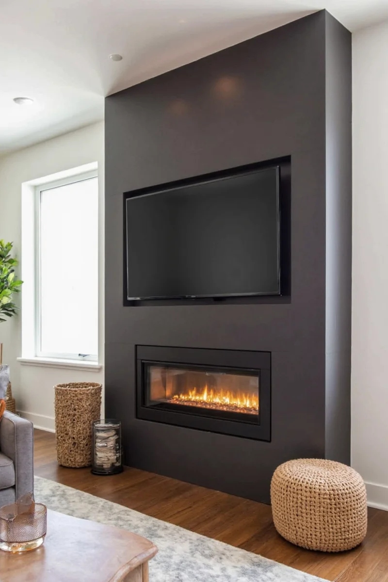 Recessed TV cavity above fireplace with hidden panels