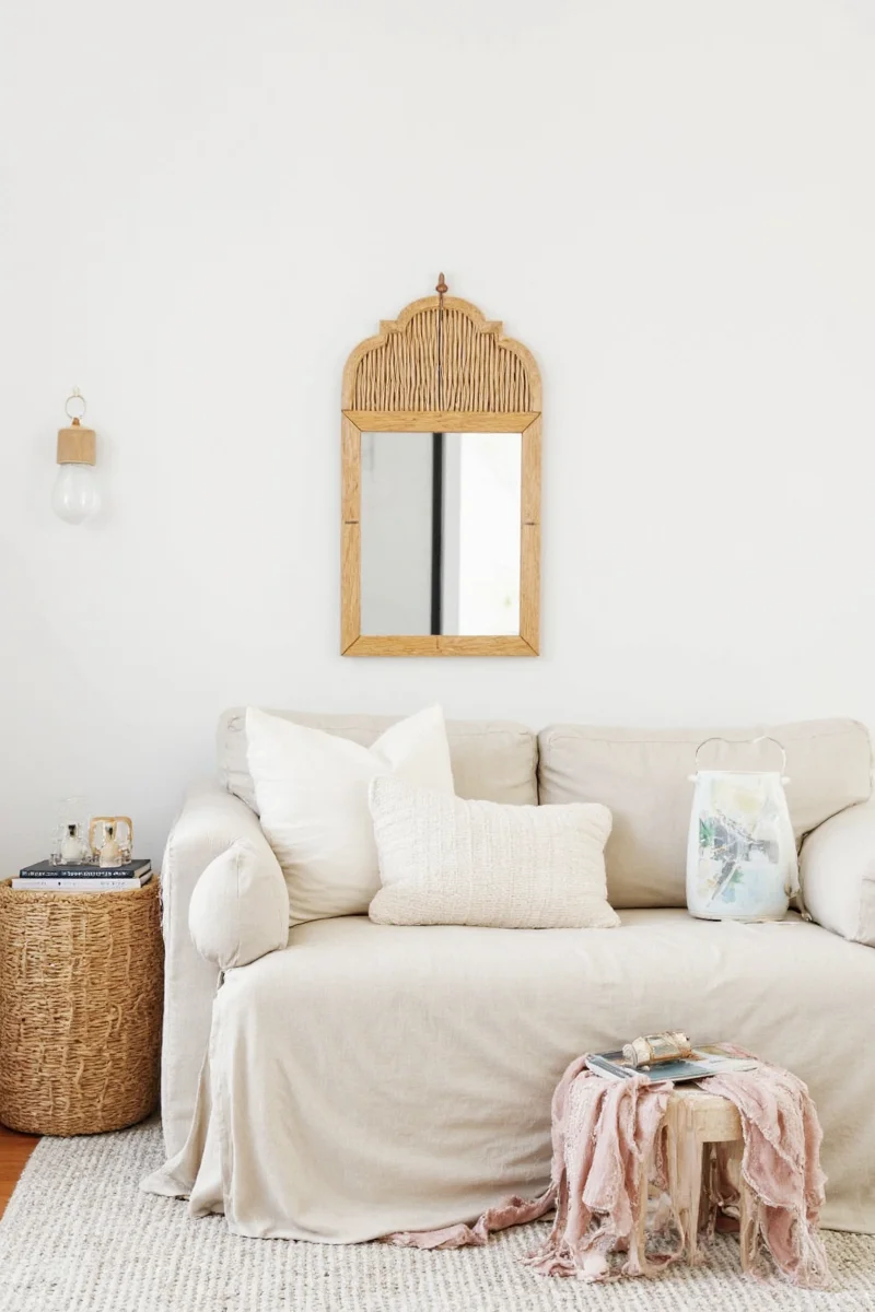Rattan scallop mirror in a cozy living room