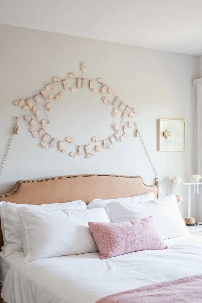Wall-mounted bookshelf above toddler bed