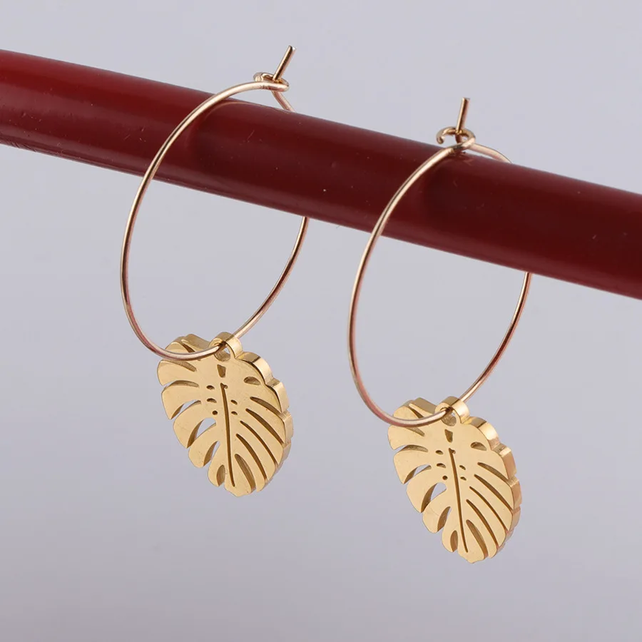 

Mirror polish fashion women hawaiian jewelry wholesale 2020 stainless steel gold plated hollow palm leaf hoop dangle earrings