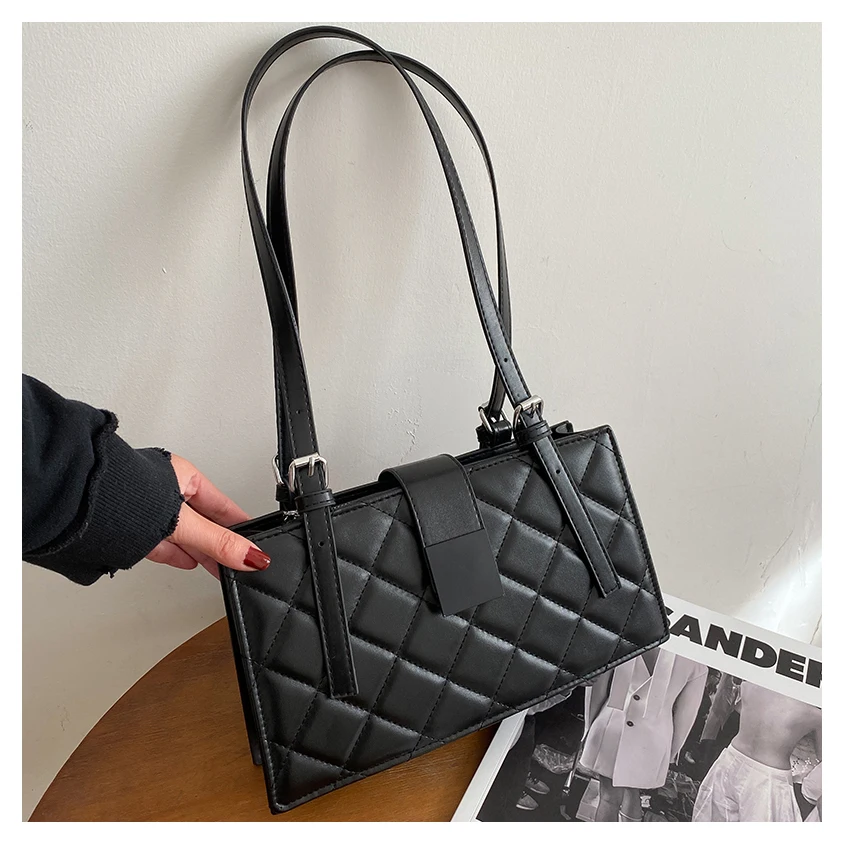 

Black quilted leather womens gold handbag