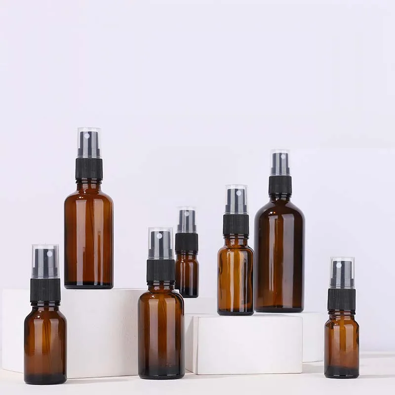 

2023 Free sample wholesale 10ml 15ml 30ml 50ml 100ml amber round glass essential oil spray pump bottles in stock