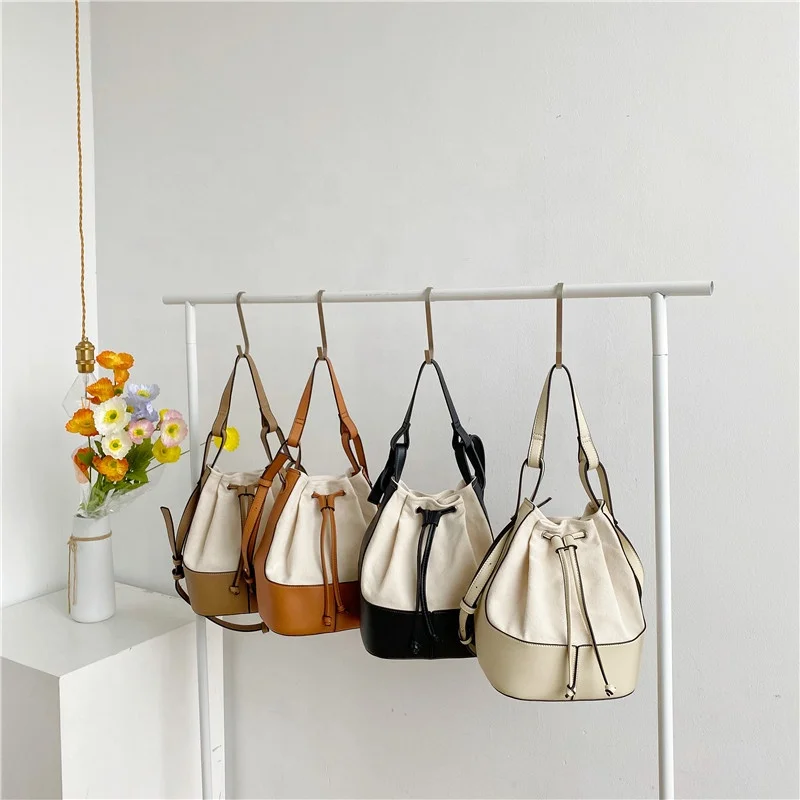 

Bag female 2021 summer Korean edition fashion trend skew cross bag personality spliced canvas hand-held bucket bag