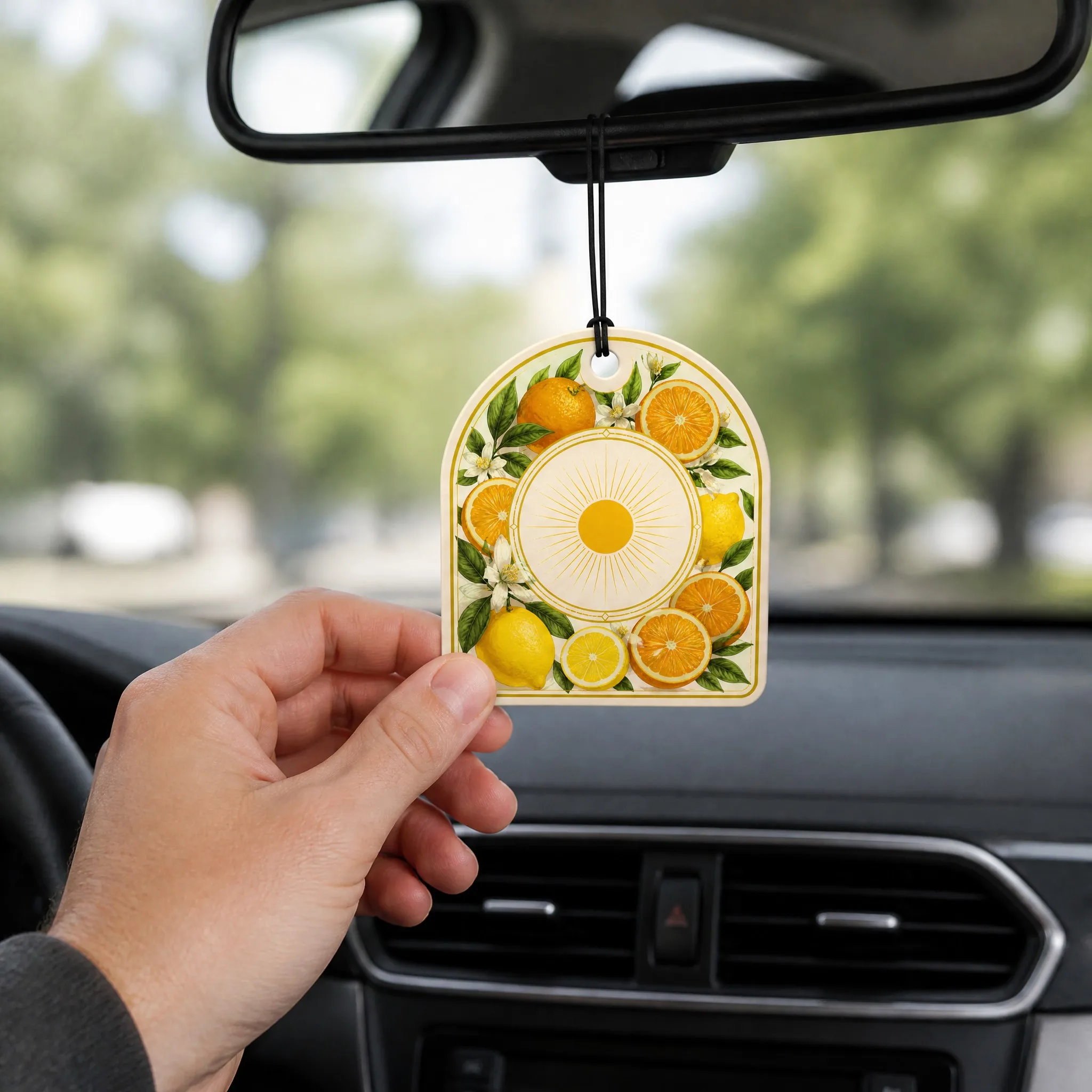 Mediterranean Citrus Scented Air Freshener Hanging in Car from Rearview Mirror Lifestyle Context