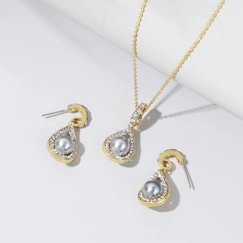 

Komi Hawaiian Fashion Jewelry Grey Pearl Gold Plated Crystals Shinny Necklace Earrings Set Jewelry Sets Polynesian Wholesale, Shown
