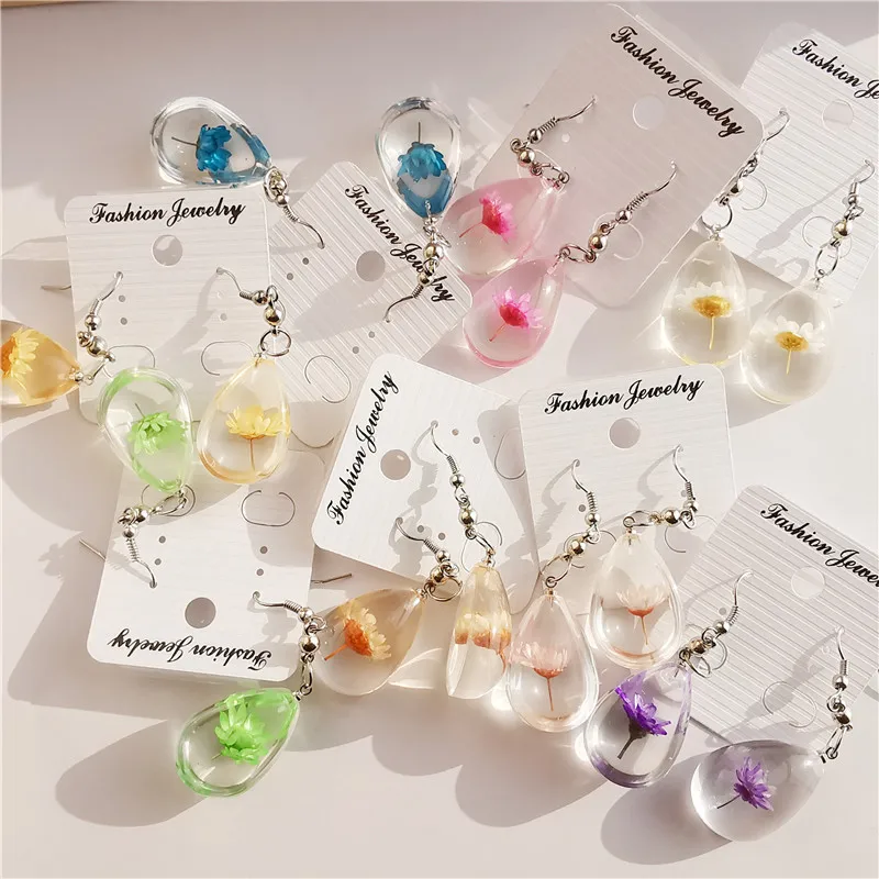 

Cross-border foreign trade source manual Epoxy dried flower earrings resin European and American real flower earrings