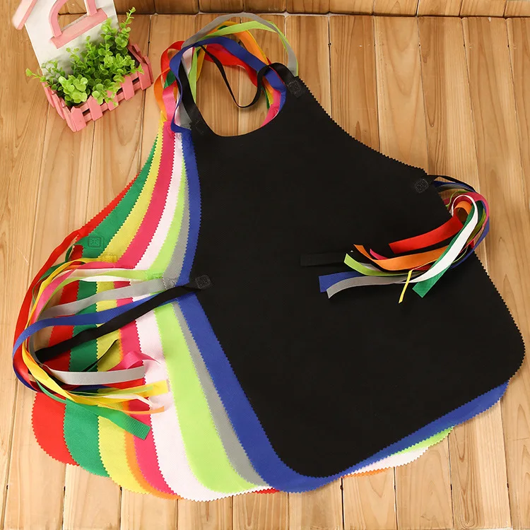 

Low MOQ stock ready color wholesale custom promotion disposable non woven bbq children painting disposable apron