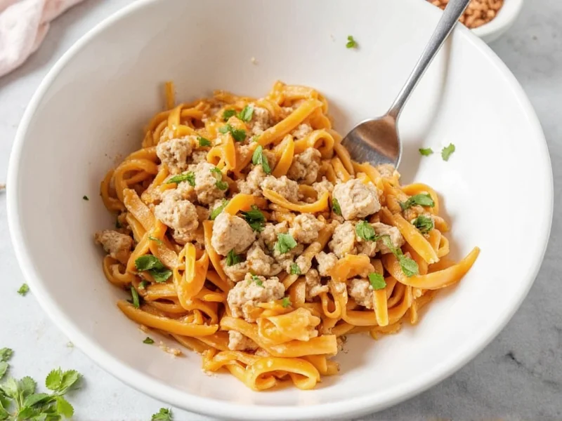 Homemade tuna helper in white bowl with fork