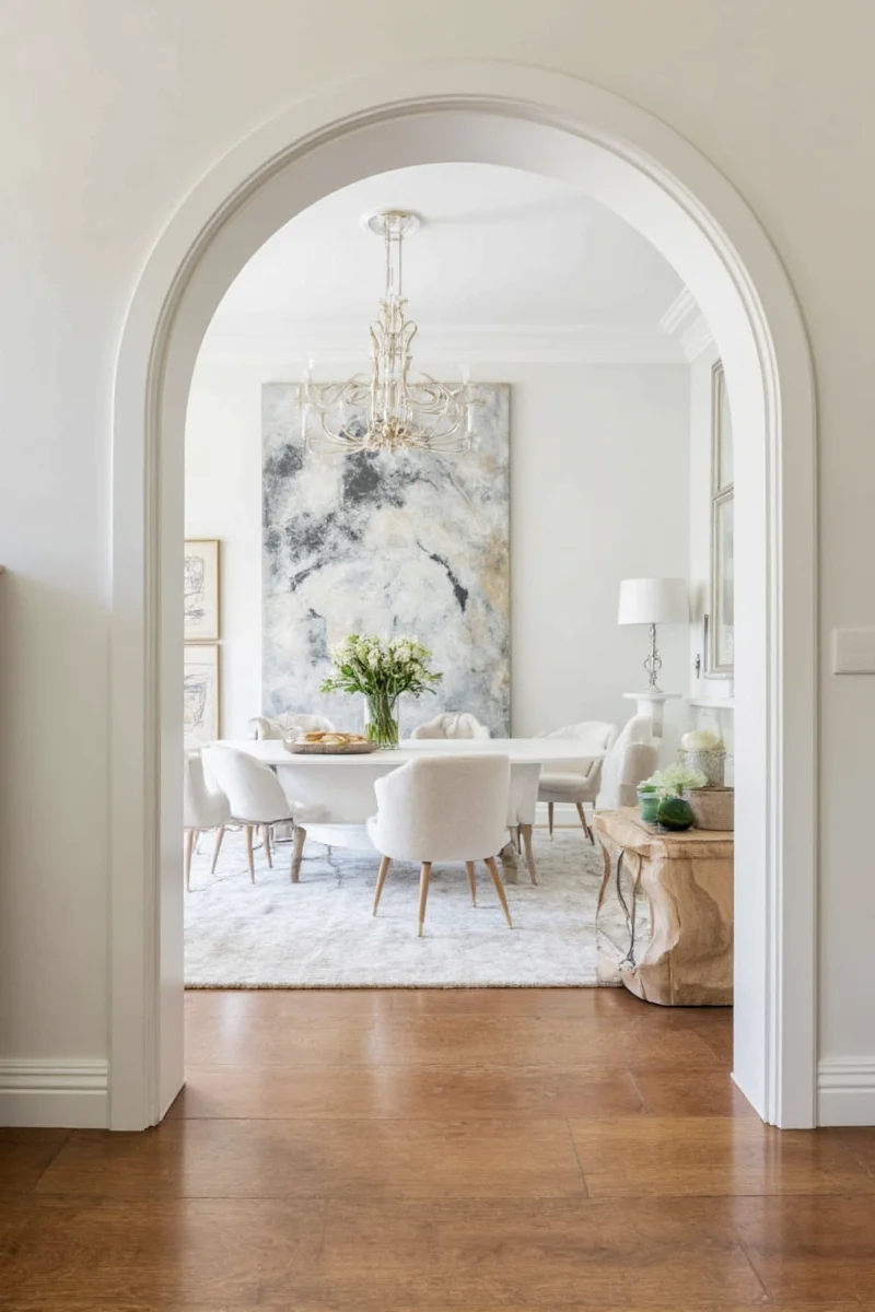 Arched doorway decorated with patterned wallpaper and LED lights