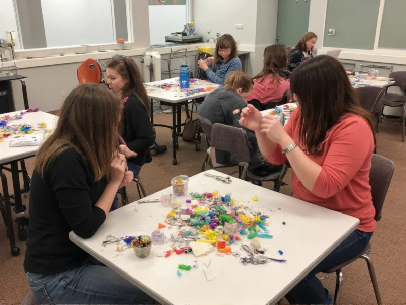 Group crafting session with recycled materials at community center