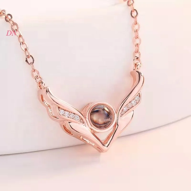 

Dina Wholesale Women Jewelry Fashion Angel Wings Necklace With 100 Languages I Love You Projection Necklace FOr Lovers Gifts, Silver,rose gold