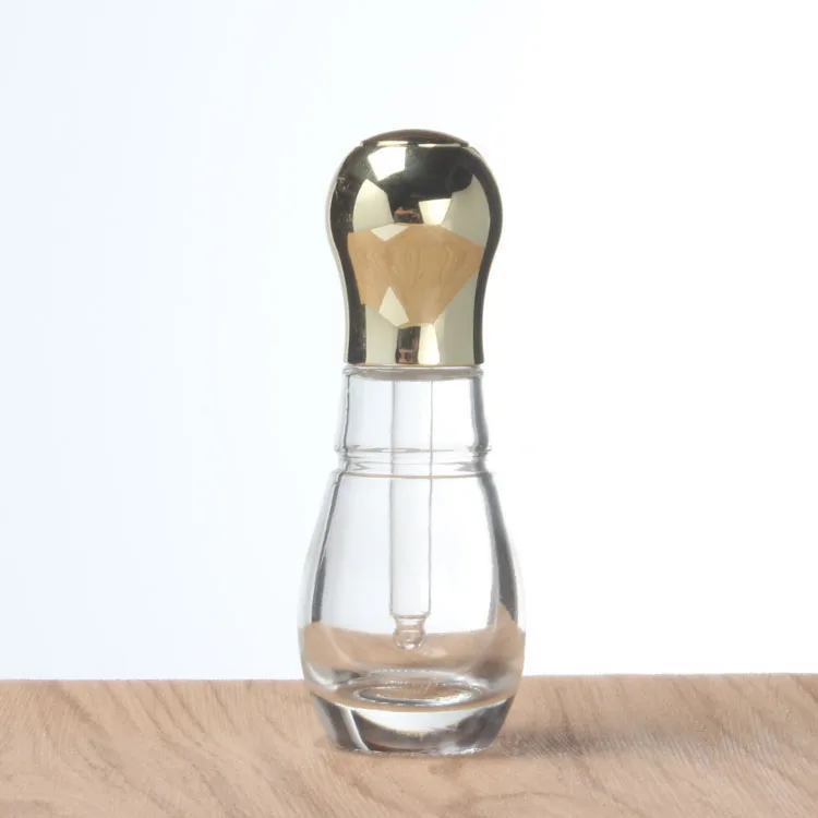 

Hot sale clear glass dropper bottle round essential oil bottle with press lid 30ml gold essential oil bottles