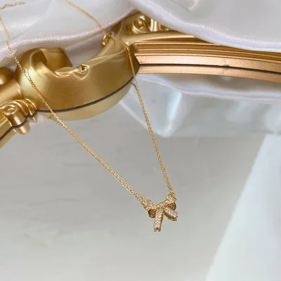 

2021 New Designed 18K Gold Plated Zircon Simple Butterfly Bow Pendant Necklace Pave Micro Zircon Stone Bow Necklace