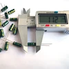 Green and gold solid aluminum electrolytic snap in capacitor