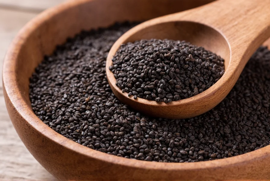 Close-up view of organic black cumin seeds in a wooden bowl with measuring spoon