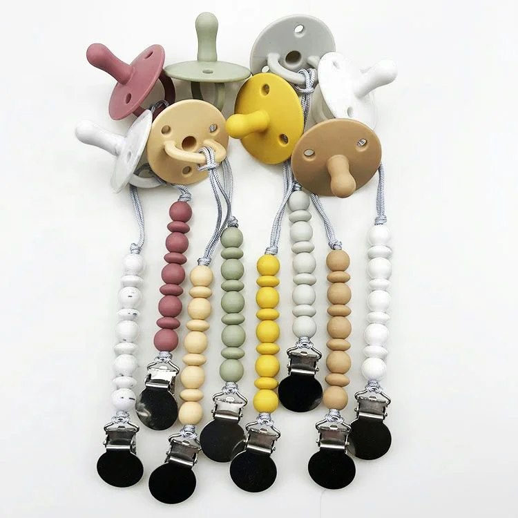 

Wholesale 100% natural feel nipple full-silicone baby pacifier with pacifier clip, Multi-colored