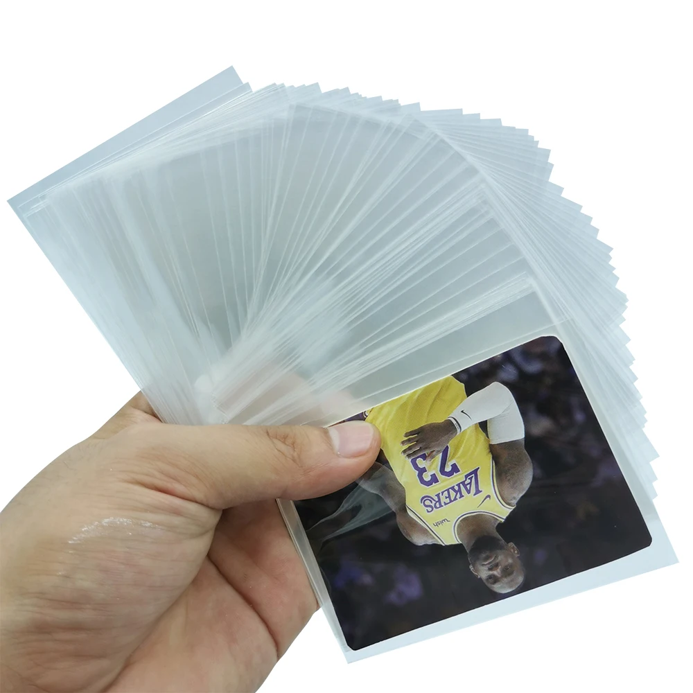 

Custom Printing 100 pcs / Pack PP plastic Trading Card Sleeves 66*91mm Trading Penny Sleeves, Transparent