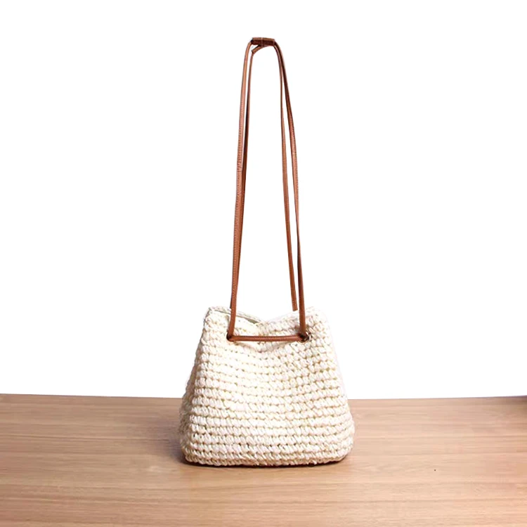 

Hot Selling Eco-friendly Beach Ladies Small Woven Straw Crocheted Drawstring Crossbody Shoulder Bag