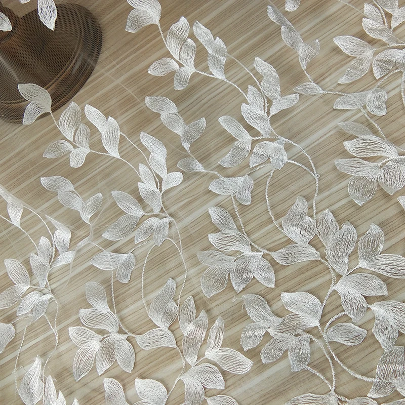 

The latest embroidery tulle leaves lace fabric for dress, Ivory