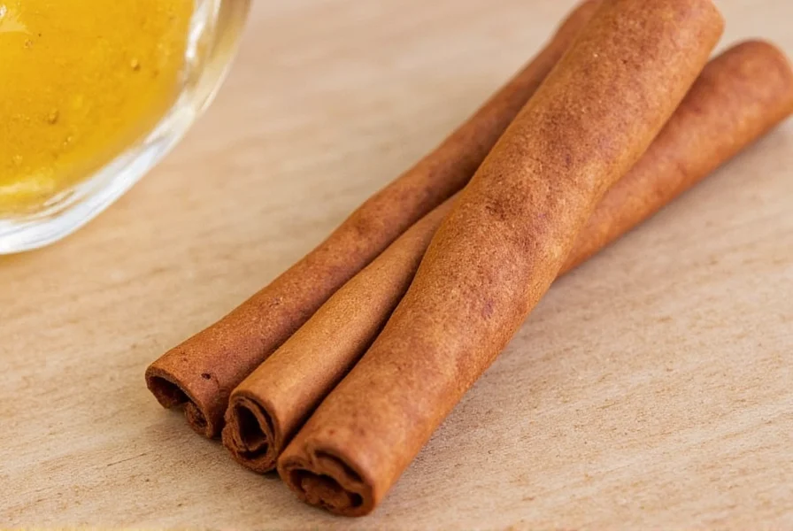 Homemade cinnamon butter being spread on warm toast with cinnamon swirls visible