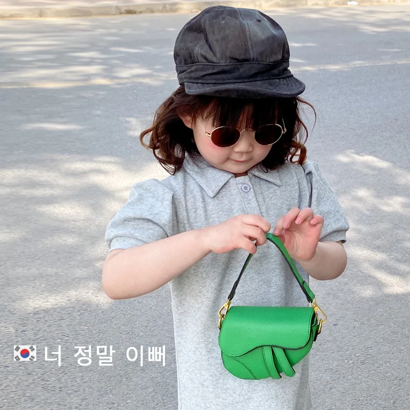 

South Korea version of foreign style mini children's hand-held saddle girls cross-body accessories concave shape women's bag