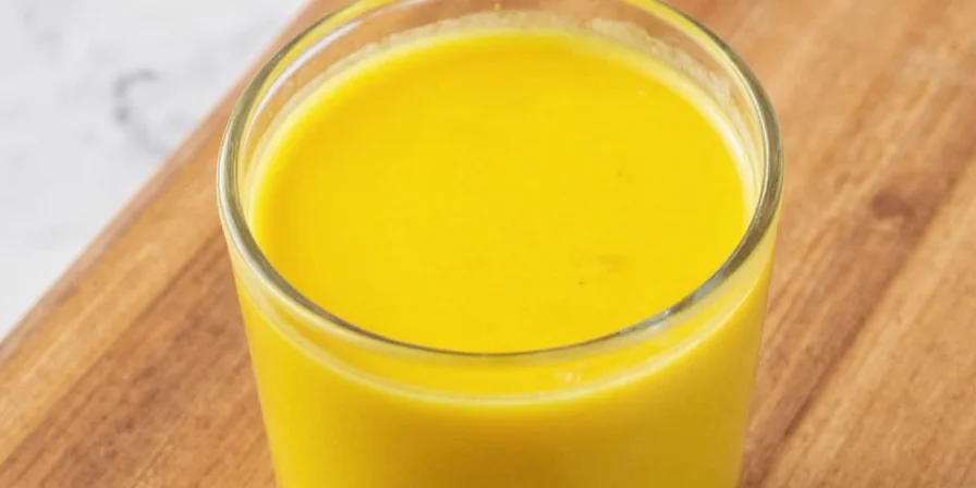 Golden Turmeric Milk in a Glass Jar