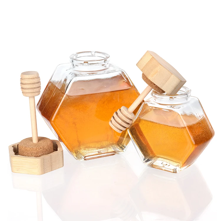

Wholesale Small Empty Packaging Mini Bee Hexagon Glass Honey Jar With Wooden Dipper