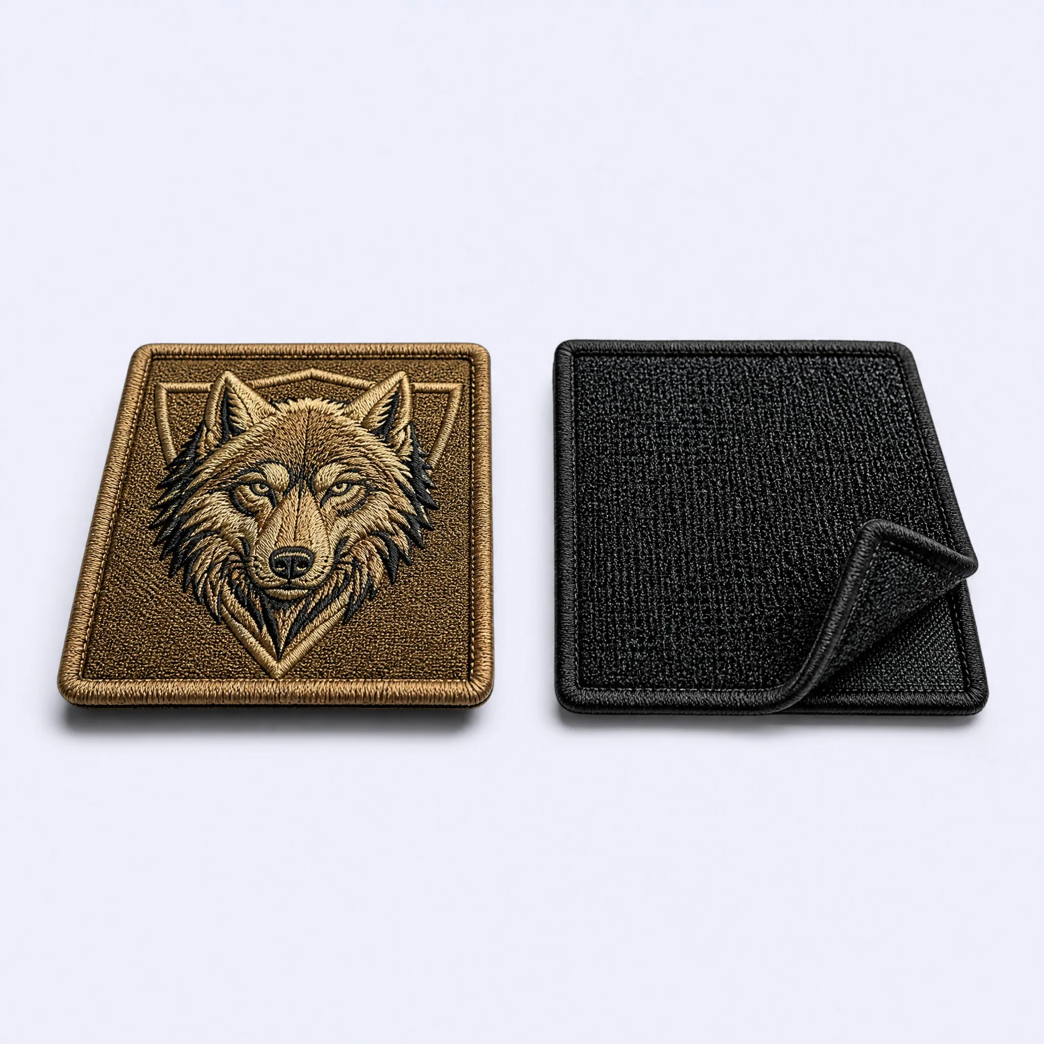 Custom Tactical Embroidered Wolf Patch in Desert Coyote Tan with Heavy Duty Hook and Loop Velcro Backing Peel View