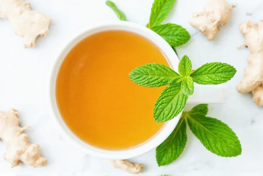 Steeping ginger mint tea in glass teapot showing vibrant color