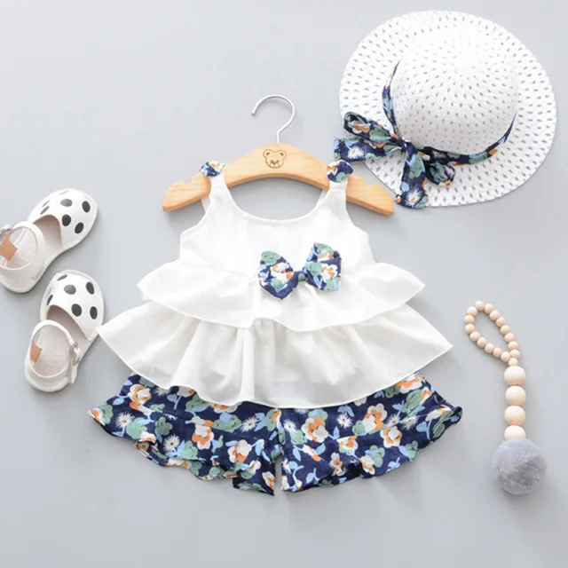 

Little girl suit with white chiffon sleeveless shirt fancy bows tiny floral shorts