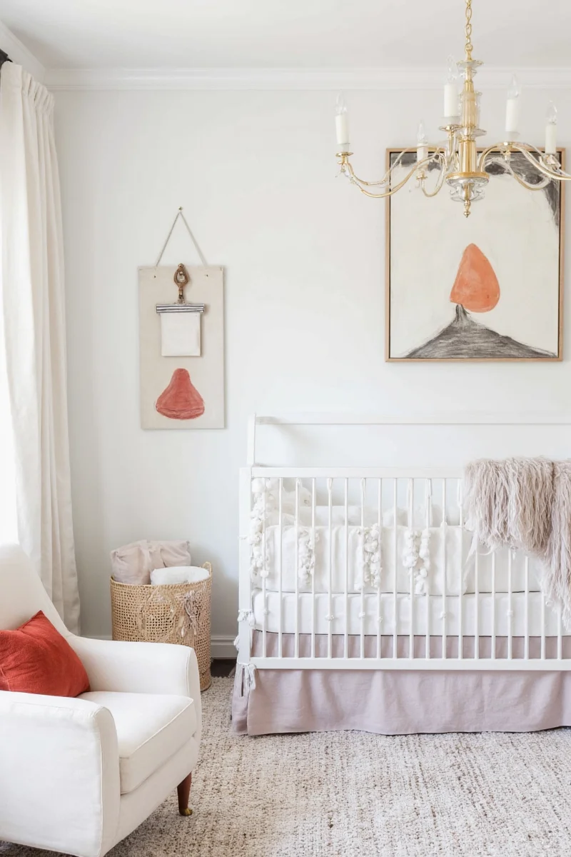Cozy baby nursery with soft lighting and natural wood furniture