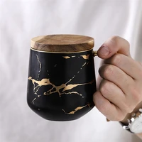 

Popular design custom logo golden handle shiny black ceramic marble coffee mugs with bamboo lid