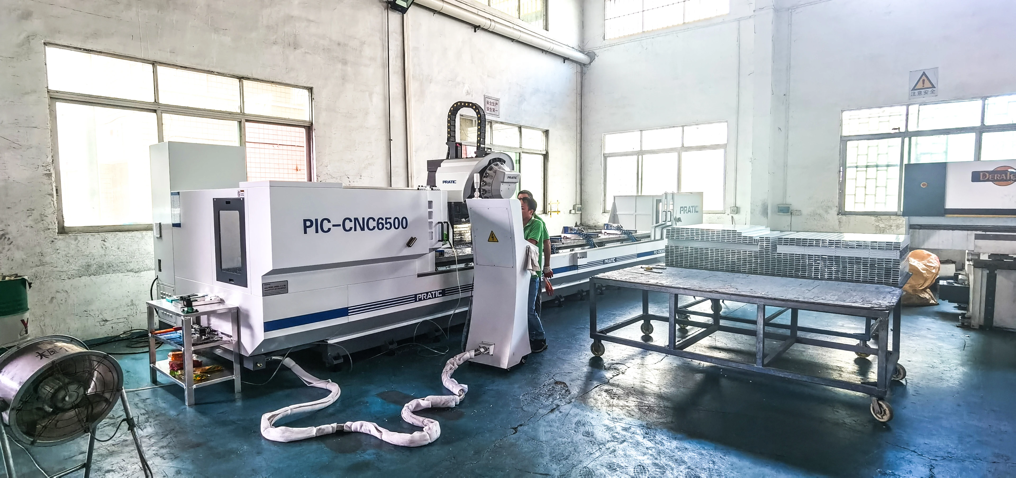 Why Solid Aluminum Veneer Panels Are the Only Safe Choice for High-Rise Facades in 2026 PRATIC PIC-CNC6500 CNC machining center at Likton factory Foshan