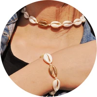 

Artilady Cowry Collar Hawaiian Adjustable Jewelry Women Boho Cord Cowrie Gold Sea Shell Necklace Bracelet Set Choker